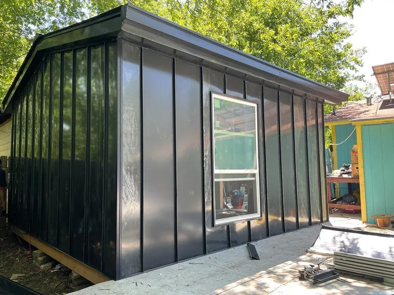 Black standing seam metal wall panels for Roof Inspection in Quincy